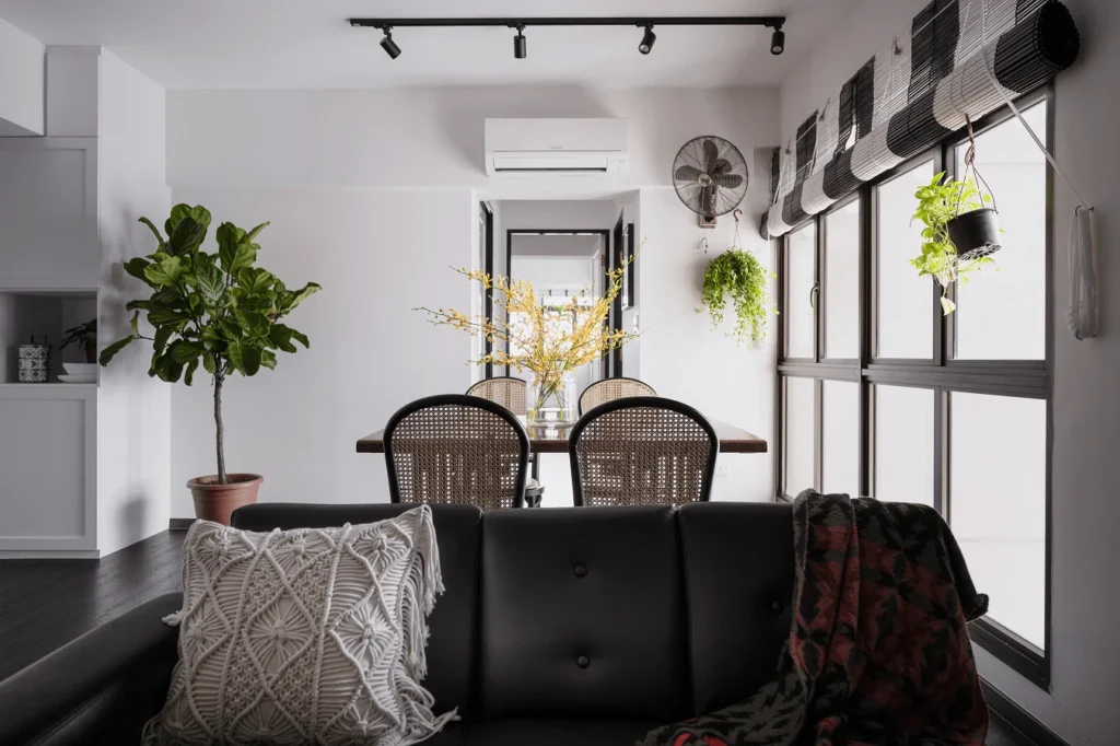 White dining area with indoor plants