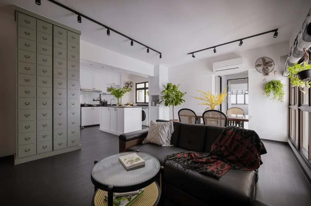 White and black living room with black ceiling track lights